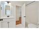 Updated bathroom featuring a white vanity, tile floors, and a view of a white subway tile shower at 968 Dean Nw Dr, Atlanta, GA 30318