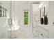 Bright bathroom with a soaking tub, herringbone floors, double vanity, and abundant natural light at 968 Dean Nw Dr, Atlanta, GA 30318