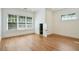 Bright bedroom features hardwood floors, large windows, and a charming little play door at 968 Dean Nw Dr, Atlanta, GA 30318