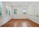 Bright, empty bedroom with hardwood floors, ample natural light, and closet space at 968 Dean Nw Dr, Atlanta, GA 30318