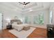Main bedroom with a trey ceiling, large windows, hardwood flooring, and neutral decor at 968 Dean Nw Dr, Atlanta, GA 30318