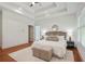 Main bedroom boasts a trey ceiling, large windows, hardwood flooring, and neutral decor at 968 Dean Nw Dr, Atlanta, GA 30318