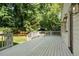 Expansive white deck offers serene views of lush landscaping with verdant lawn at 968 Dean Nw Dr, Atlanta, GA 30318