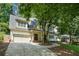 Charming home with a two-car garage, mature trees, and a covered porch, offering great curb appeal at 968 Dean Nw Dr, Atlanta, GA 30318