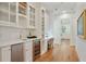 Hallway with a wet bar, wine fridge, and desk at 968 Dean Nw Dr, Atlanta, GA 30318