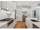 Modern kitchen featuring stainless steel appliances, gas range, and white cabinetry at 968 Dean Nw Dr, Atlanta, GA 30318