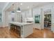 Stylish white kitchen featuring a large island with seating and stainless steel appliances at 968 Dean Nw Dr, Atlanta, GA 30318