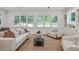 Bright and inviting living room with neutral furnishings, hardwood floors, and built-in shelving at 968 Dean Nw Dr, Atlanta, GA 30318
