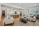Open-concept living room and kitchen with hardwood floors and modern decor at 968 Dean Nw Dr, Atlanta, GA 30318