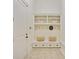 Well-organized mudroom with built-in bench, shelving, and storage at 968 Dean Nw Dr, Atlanta, GA 30318