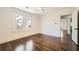 Bedroom featuring hardwood floors, large windows, a ceiling fan and an open doorway at 1337 M L King Jr Nw Dr, Atlanta, GA 30314