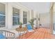 Cozy front porch with rattan seating and terra cotta tile, perfect for relaxing and enjoying the view at 1337 M L King Jr Nw Dr, Atlanta, GA 30314