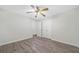 Charming bedroom with wood-look floors, ceiling fan with lighting, and a closet with double doors at 3235 Harms Way, Snellville, GA 30039