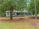 Charming single-story home features a symmetrical facade, gray siding, and a welcoming front porch at 3235 Harms Way, Snellville, GA 30039