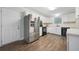 Functional kitchen with stainless steel appliances and updated countertops for easy living at 3235 Harms Way, Snellville, GA 30039