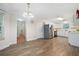 Bright kitchen with stainless steel appliances and access to the dining area at 3235 Harms Way, Snellville, GA 30039