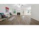Well-lit living room showcases hardwood floors, cozy fireplace, and updated paint at 3235 Harms Way, Snellville, GA 30039
