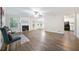 Spacious living room featuring durable flooring, fireplace, and seamless flow to the kitchen at 3235 Harms Way, Snellville, GA 30039