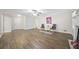 Spacious living room featuring hardwood floors, a ceiling fan, and two comfortable chairs at 3235 Harms Way, Snellville, GA 30039