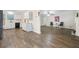 View of the living room from the kitchen featuring hardwood floors and a cozy atmosphere at 3235 Harms Way, Snellville, GA 30039