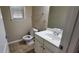 Cozy powder room features a vanity, mirror, and fixtures at 571 Cold Water Ln, Mcdonough, GA 30252