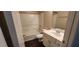 A clean and well-maintained bathroom with white fixtures and tile at 571 Cold Water Ln, Mcdonough, GA 30252