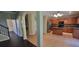 Spacious kitchen features stainless appliances, center island, ample cabinet storage, and tile floor at 571 Cold Water Ln, Mcdonough, GA 30252