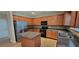 Kitchen with stainless steel appliances, dark countertops, and tile backsplash at 571 Cold Water Ln, Mcdonough, GA 30252