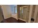 Main bathroom features a soaking tub and a glass-enclosed shower at 571 Cold Water Ln, Mcdonough, GA 30252
