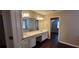 Double sink vanity in a bright main bathroom at 571 Cold Water Ln, Mcdonough, GA 30252