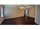 Spacious main bedroom suite featuring a trey ceiling and dark wood-look flooring at 571 Cold Water Ln, Mcdonough, GA 30252