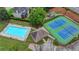 Aerial view showcases community amenities: pool, tennis courts, and recreation areas at 1640 Mount Mckinley Dr, Grayson, GA 30017