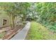 Scenic backyard with lush landscaping, a walkway, and greenery providing a private and tranquil environment at 1640 Mount Mckinley Dr, Grayson, GA 30017