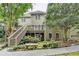 Beautiful backyard featuring a wooden deck, stairs, a stone bench, and a small decorative waterfall at 1640 Mount Mckinley Dr, Grayson, GA 30017