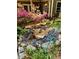 Landscaped backyard with a rock garden and a water feature, perfect for enjoying nature at 1640 Mount Mckinley Dr, Grayson, GA 30017