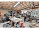 Workshop area in an unfinished basement, with ample storage and natural light at 1640 Mount Mckinley Dr, Grayson, GA 30017