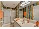 This bathroom features a glass shower, and modern vanity with ample counter space at 1640 Mount Mckinley Dr, Grayson, GA 30017
