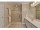 Bright bathroom featuring an enclosed shower and a large vanity at 1640 Mount Mckinley Dr, Grayson, GA 30017