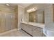 Bathroom with an enclosed shower and vanity with large mirror at 1640 Mount Mckinley Dr, Grayson, GA 30017