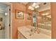 Light and bright bathroom features an extended vanity and plenty of storage at 1640 Mount Mckinley Dr, Grayson, GA 30017