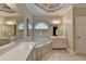 Bright bathroom featuring jacuzzi bathtub and patterned wallpaper at 1640 Mount Mckinley Dr, Grayson, GA 30017