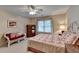 Cozy bedroom with natural light, ceiling fan, and comfortable seating area at 1640 Mount Mckinley Dr, Grayson, GA 30017