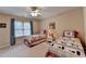 Bedroom featuring two beds, a ceiling fan and a window with blinds at 1640 Mount Mckinley Dr, Grayson, GA 30017