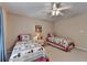 Bedroom featuring two beds, a ceiling fan and a window with blinds at 1640 Mount Mckinley Dr, Grayson, GA 30017