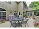 Back deck perfect for entertaining with outdoor dining set and lush landscaping at 1640 Mount Mckinley Dr, Grayson, GA 30017