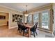 Bright dining area featuring tile flooring, natural light, and a view of the backyard at 1640 Mount Mckinley Dr, Grayson, GA 30017