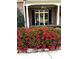 Beautiful flower bed in front of the home enhances curb appeal at 1640 Mount Mckinley Dr, Grayson, GA 30017
