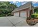 Spacious two-car garage with an ample driveway in a brick house at 1640 Mount Mckinley Dr, Grayson, GA 30017