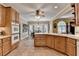 Well-equipped kitchen offering wooden cabinets, tiled floors, and adjacent breakfast area at 1640 Mount Mckinley Dr, Grayson, GA 30017