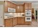 Stylish kitchen with wood cabinets, and built-in stainless steel appliances at 1640 Mount Mckinley Dr, Grayson, GA 30017